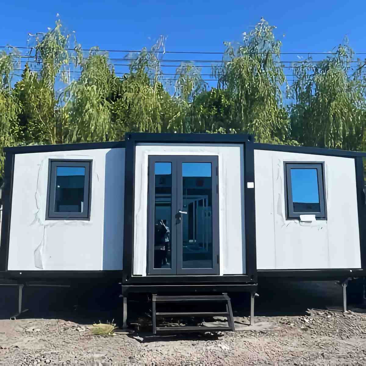 20ft white & Black Expandable Container Home With 3 wheel trailer